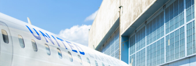 Hangar with the CRJ550 in front of the building