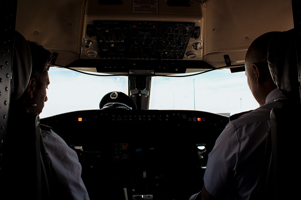 Captain and First Officer sitting in the flight deck