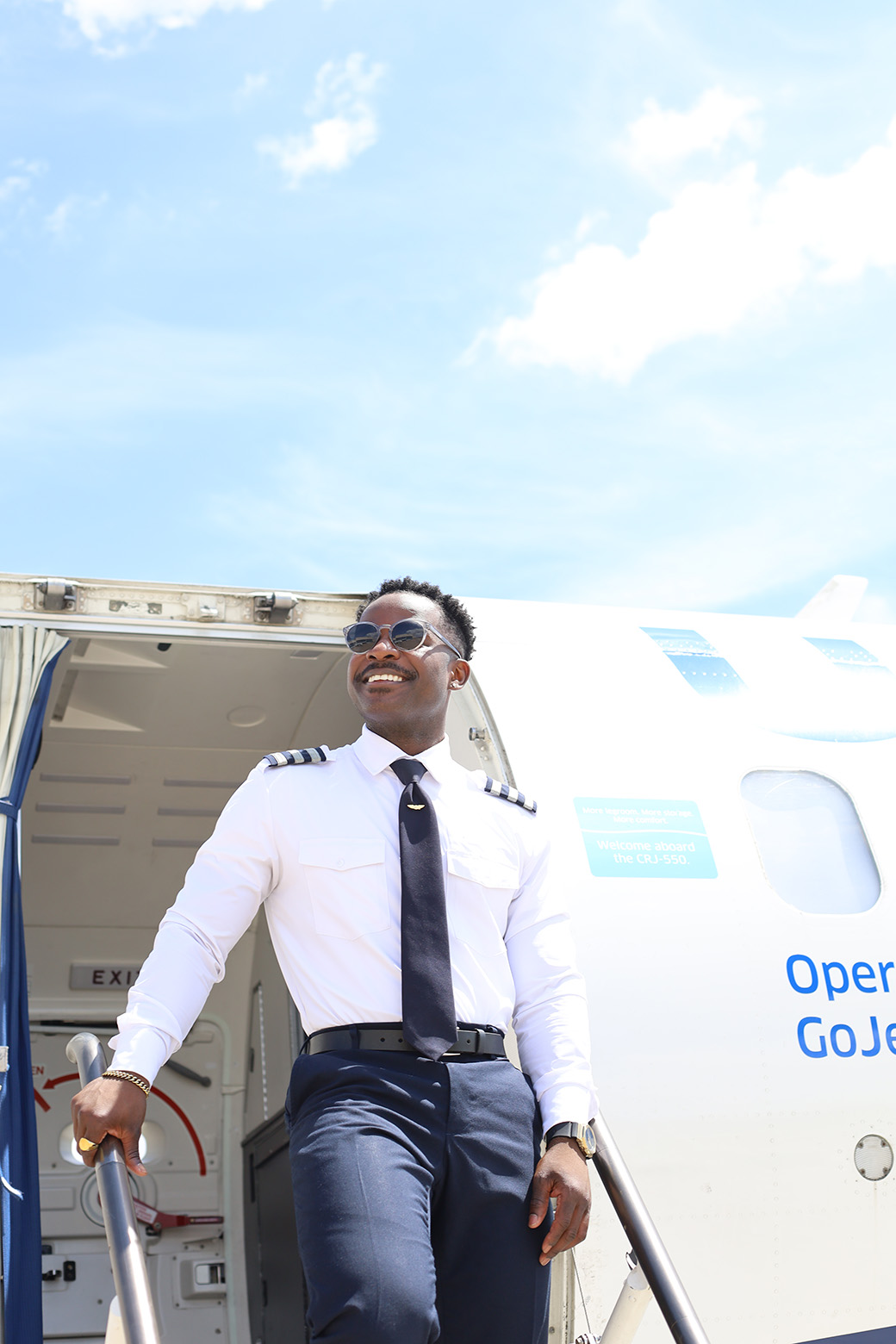 First Officer smiling on CRJ-550 steps